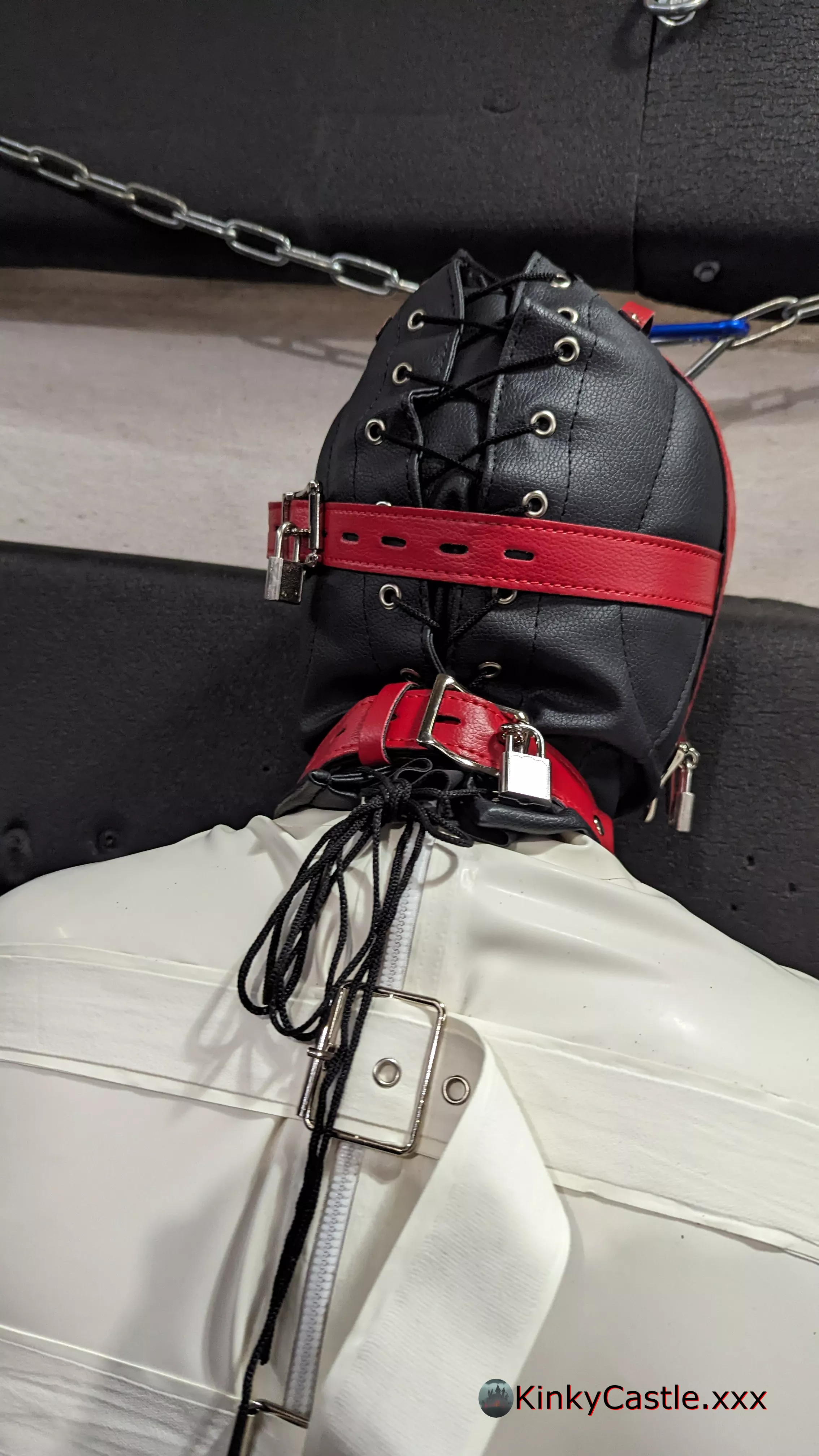 Padlocked in a sensory deprivation hood, with a latex straightjacket. [OC] [NB] [CC-SA]