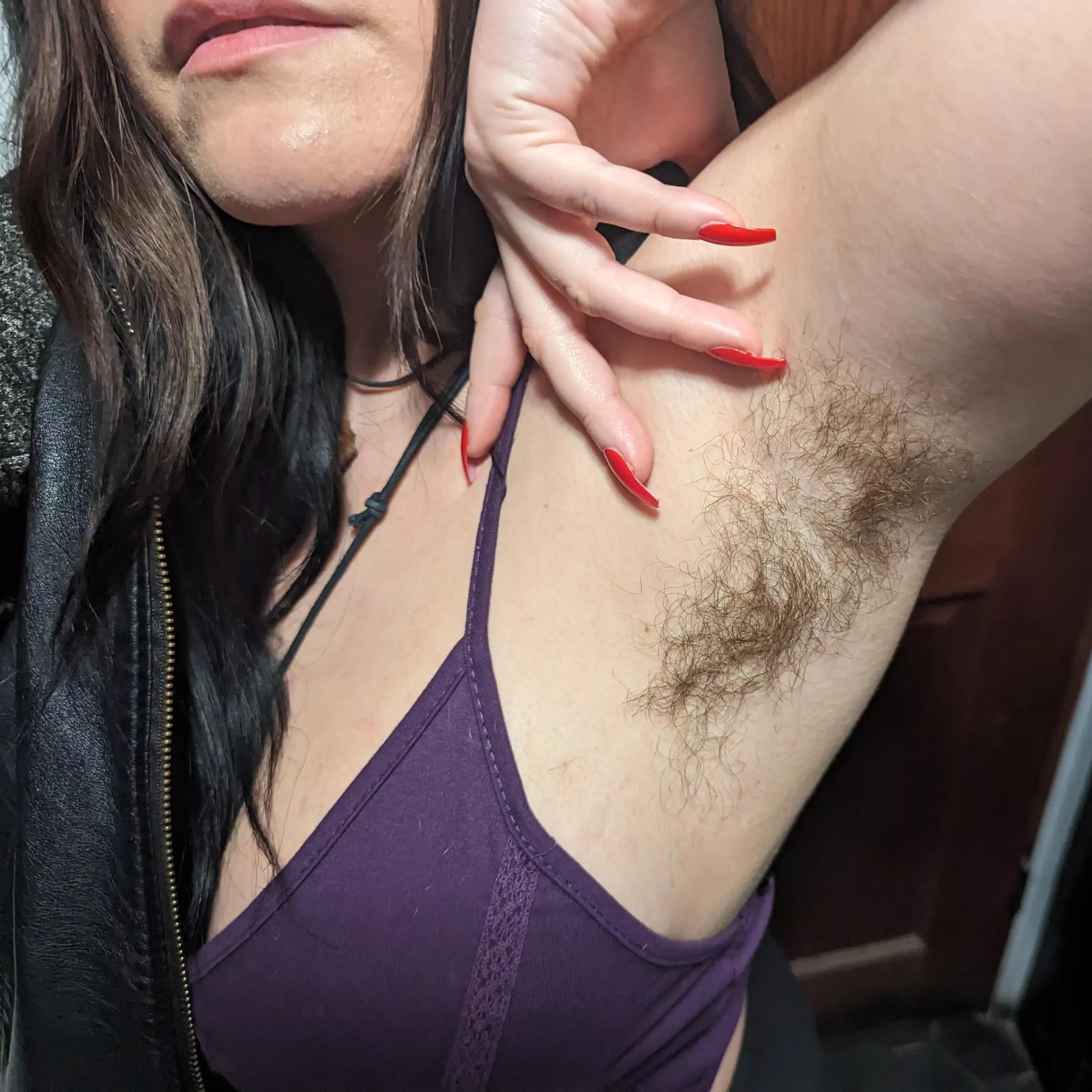 Hairy pits and red nails