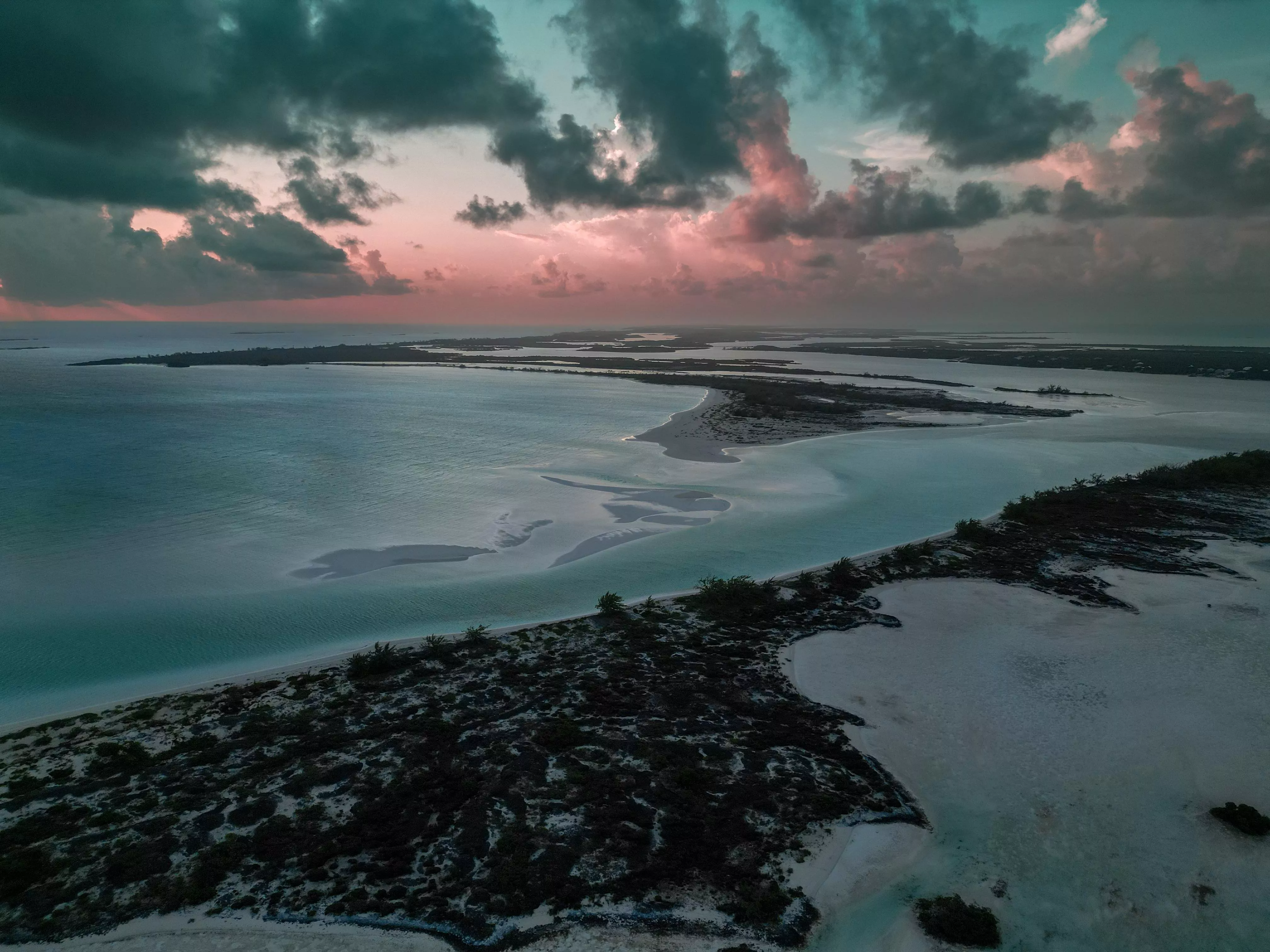 A cloudy sunrise over Man-O-War Cay and Moriah Harbour Cay.