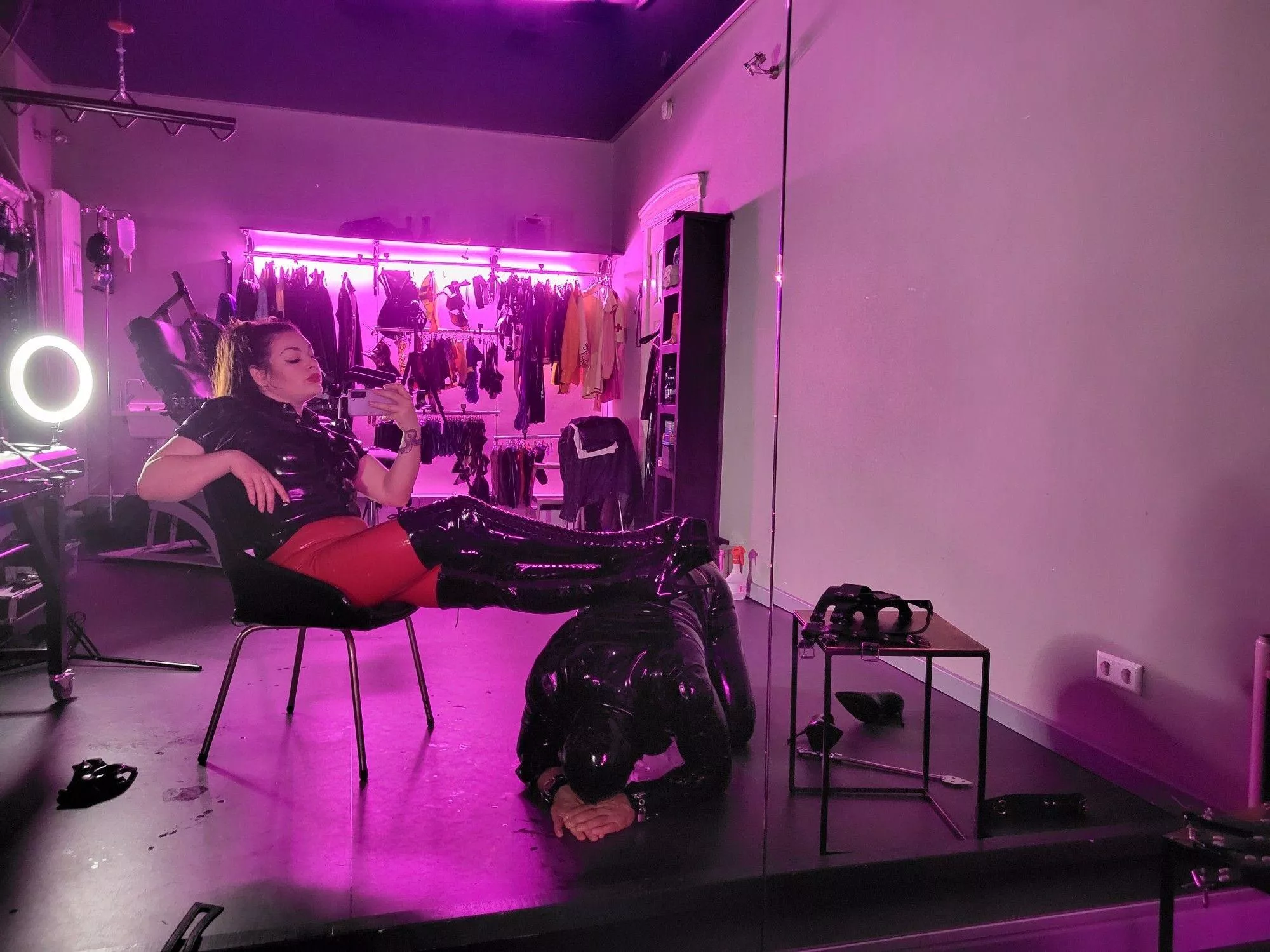 Human footstool in the dungeon for latex Mistress