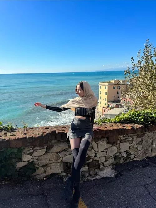 In black sheer tights with nylon kneee socks