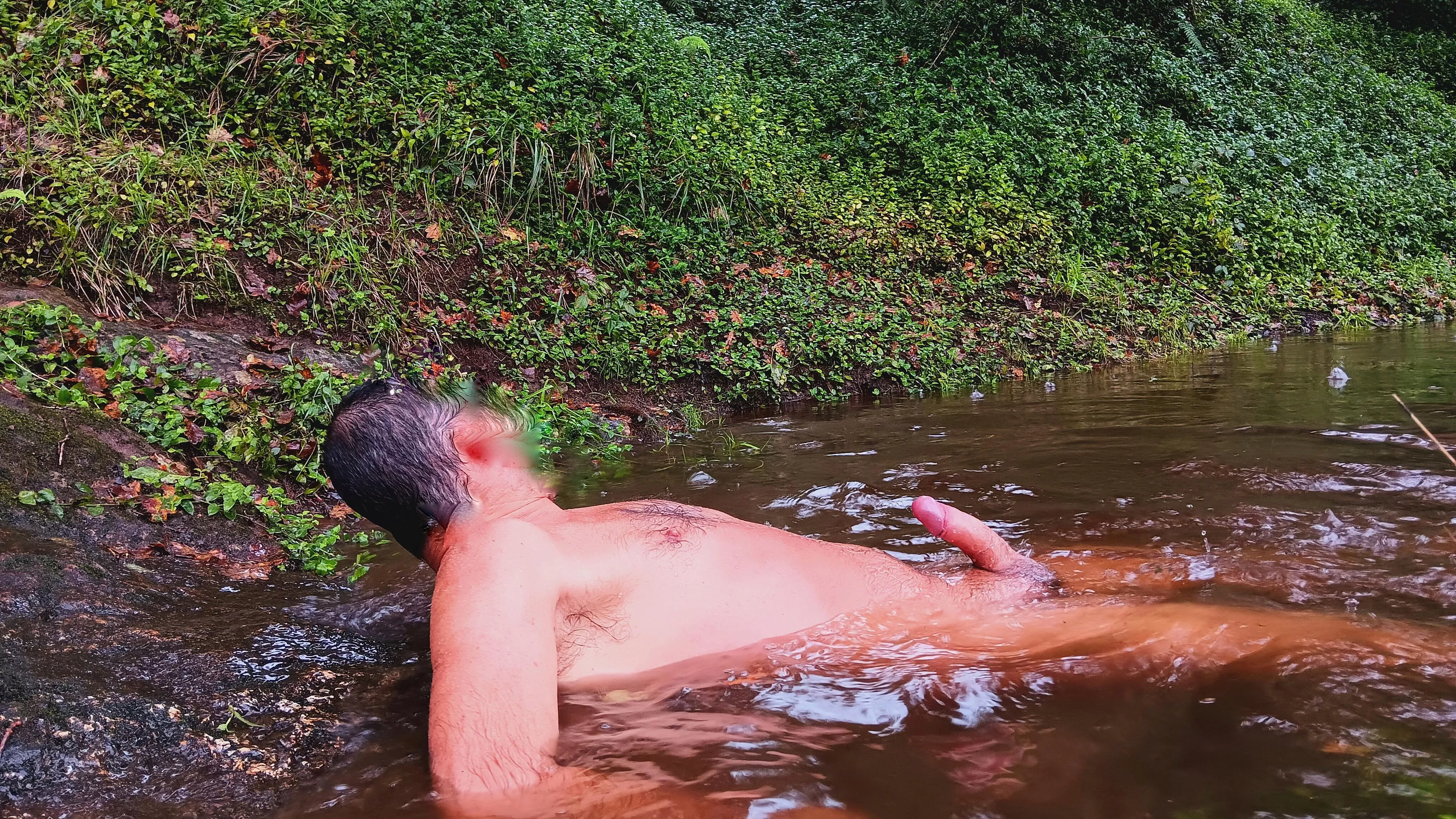 Boner in the river. Under the rain