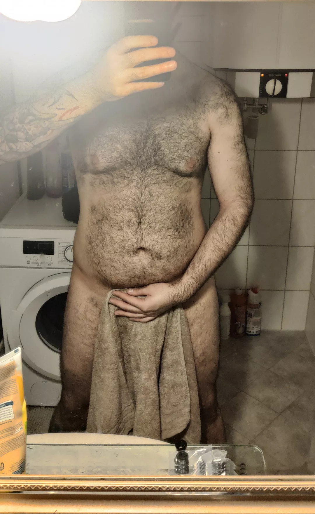 Fresh out of the shower, leaving something to the imagination