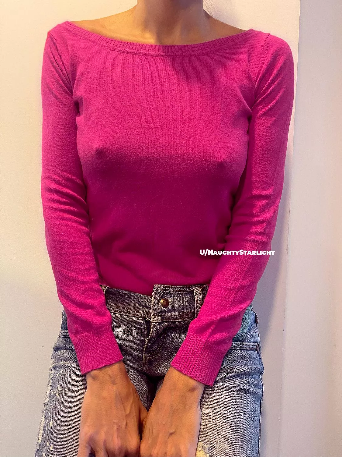 Braless in a pink sweater