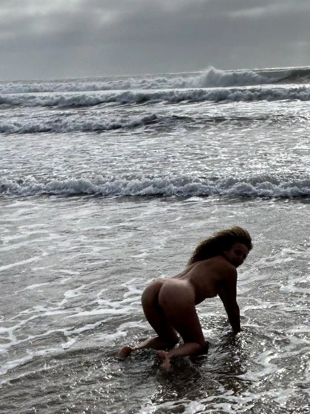 Early morning ocean skinny dip at a public beach