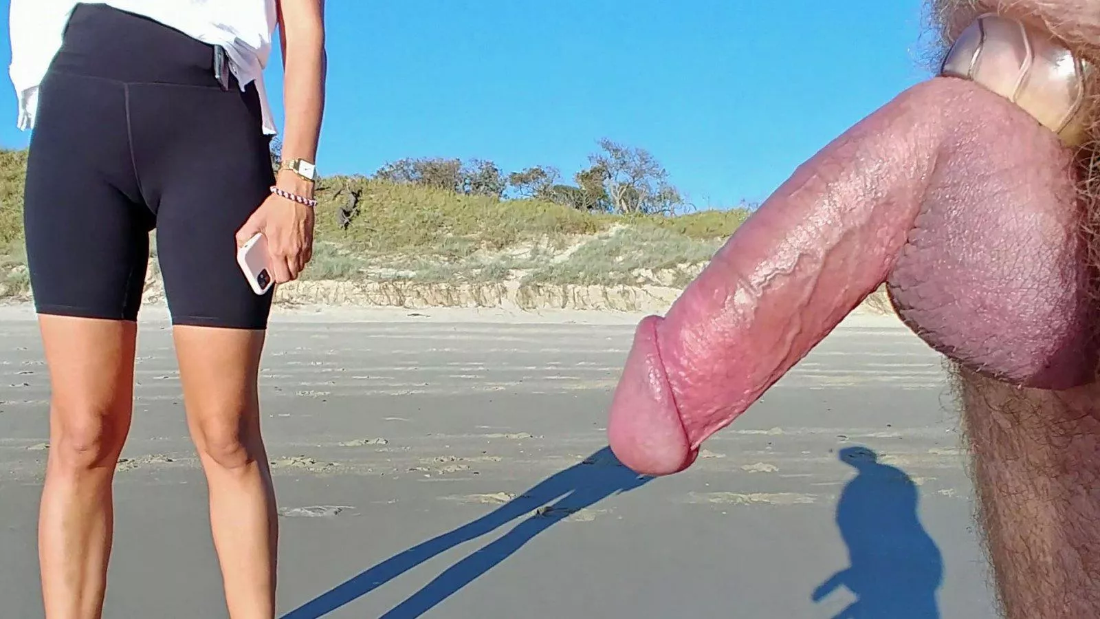 Just love the shadow of his public erection and cockring and the beach and the outline of her pussy!! Nice CFNM as well.