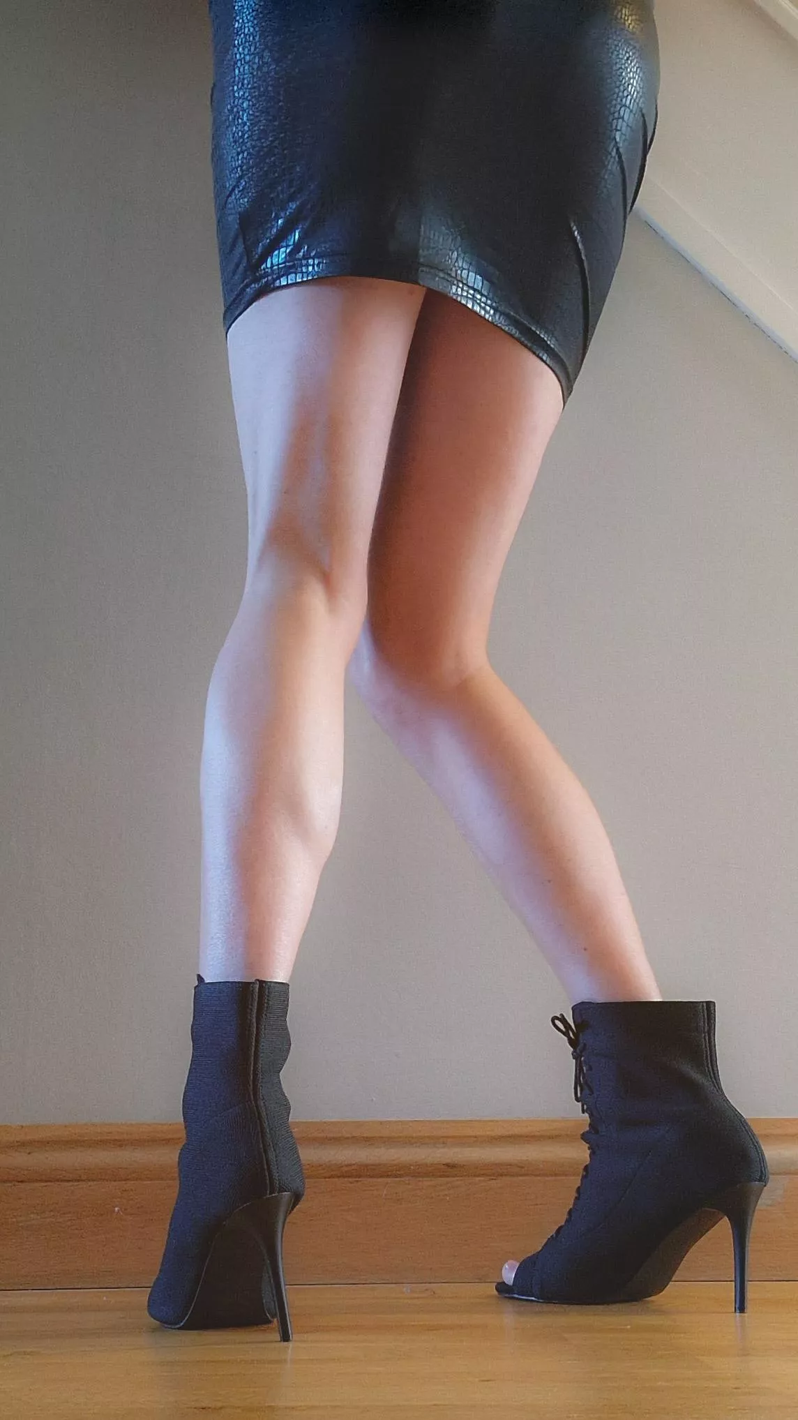 Bare legs and heeled boots today [M]