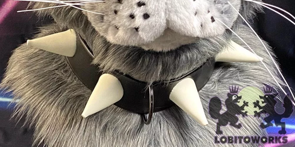I want to hand make a spiked collar for my fursuit head. I want the end result to look like the one below. It’s not my work, watermark on image! How would I go about it? All I have is construction paper and some other stuff.