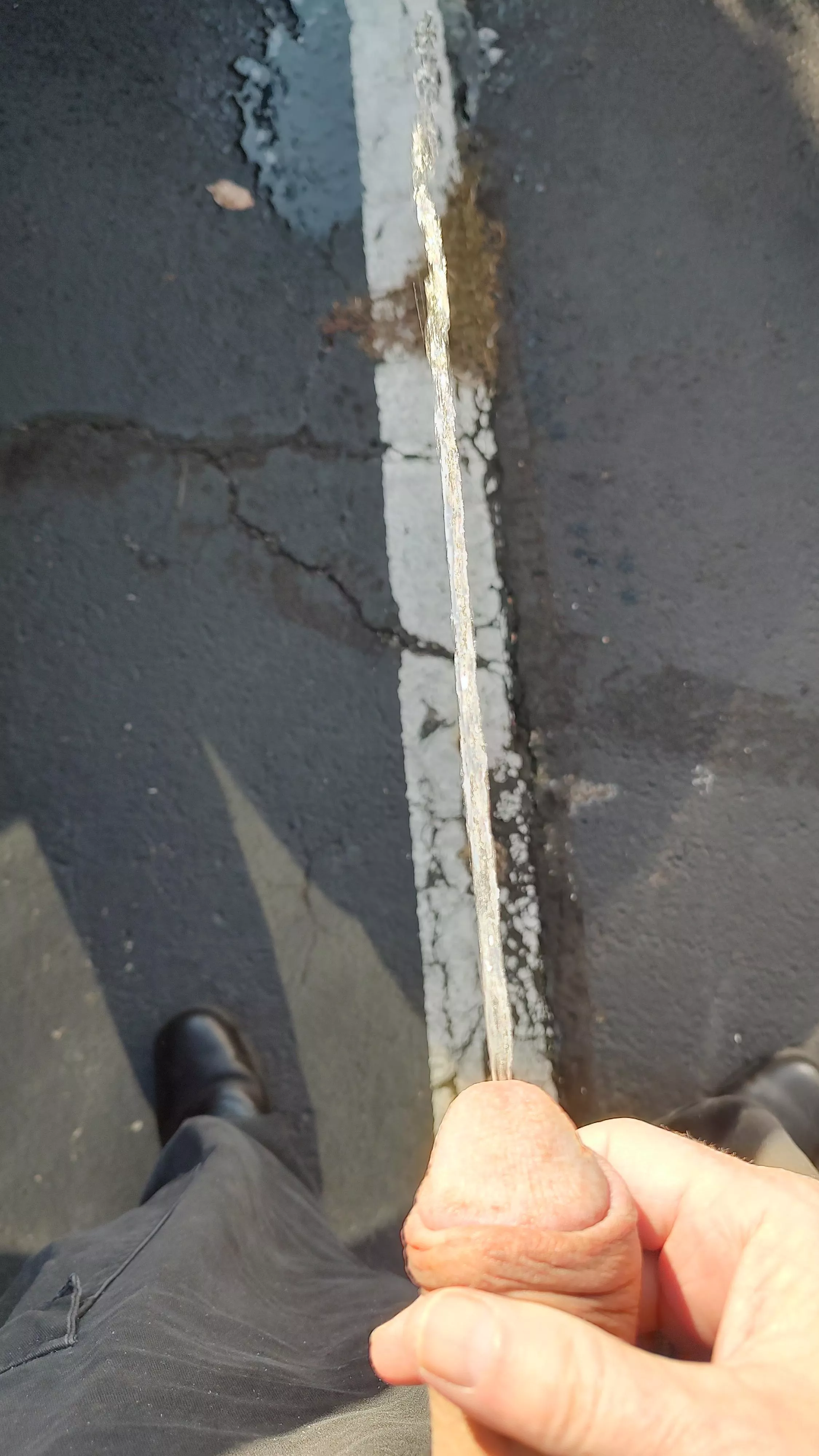 Relieving myself in a public parking lot while on duty and look at the straight lines 😉