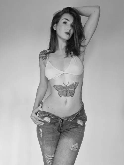 Ripped jeanes and a tiny bra