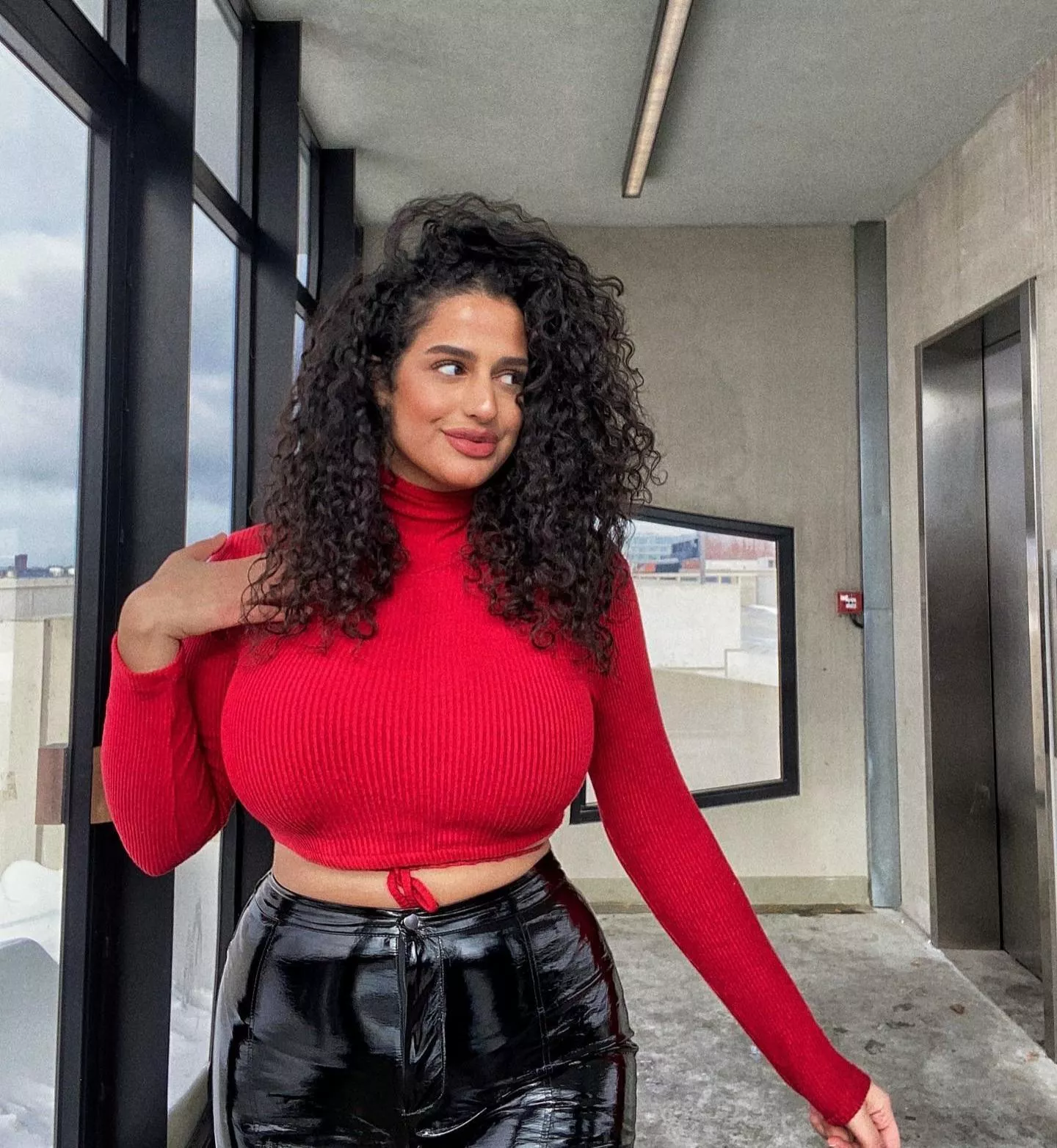 Her top is red, her boobs are ready to be pet