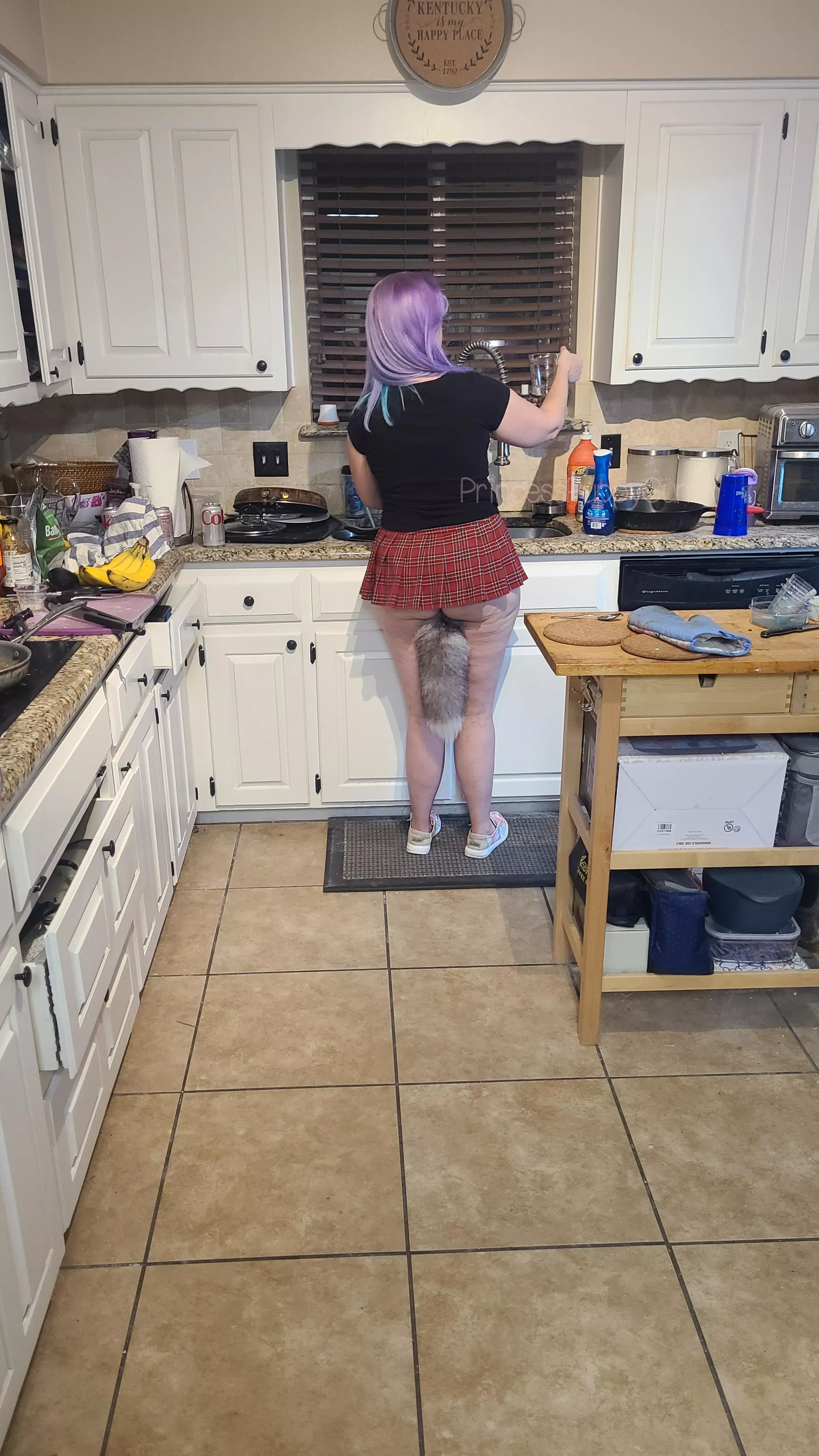 Just a little puppy washing the dishes 🐾