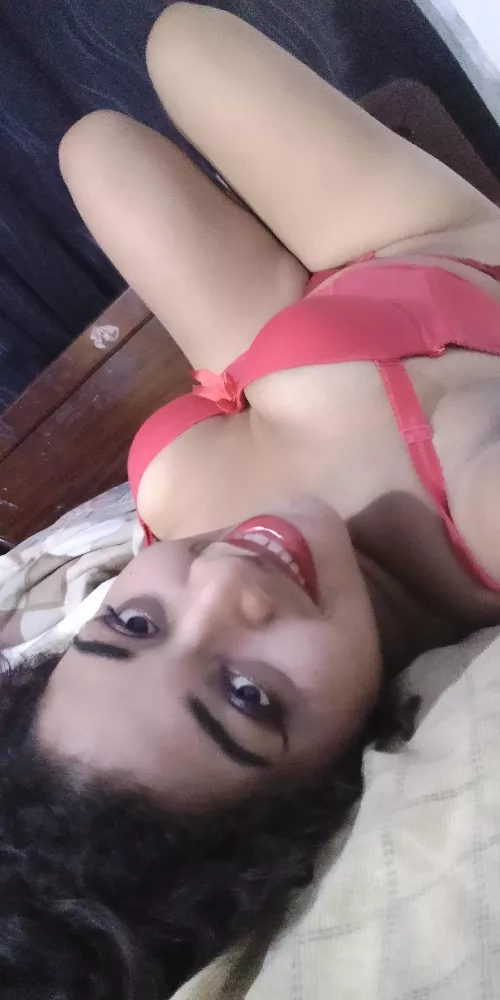 Big smile and natural boobs in a red bra