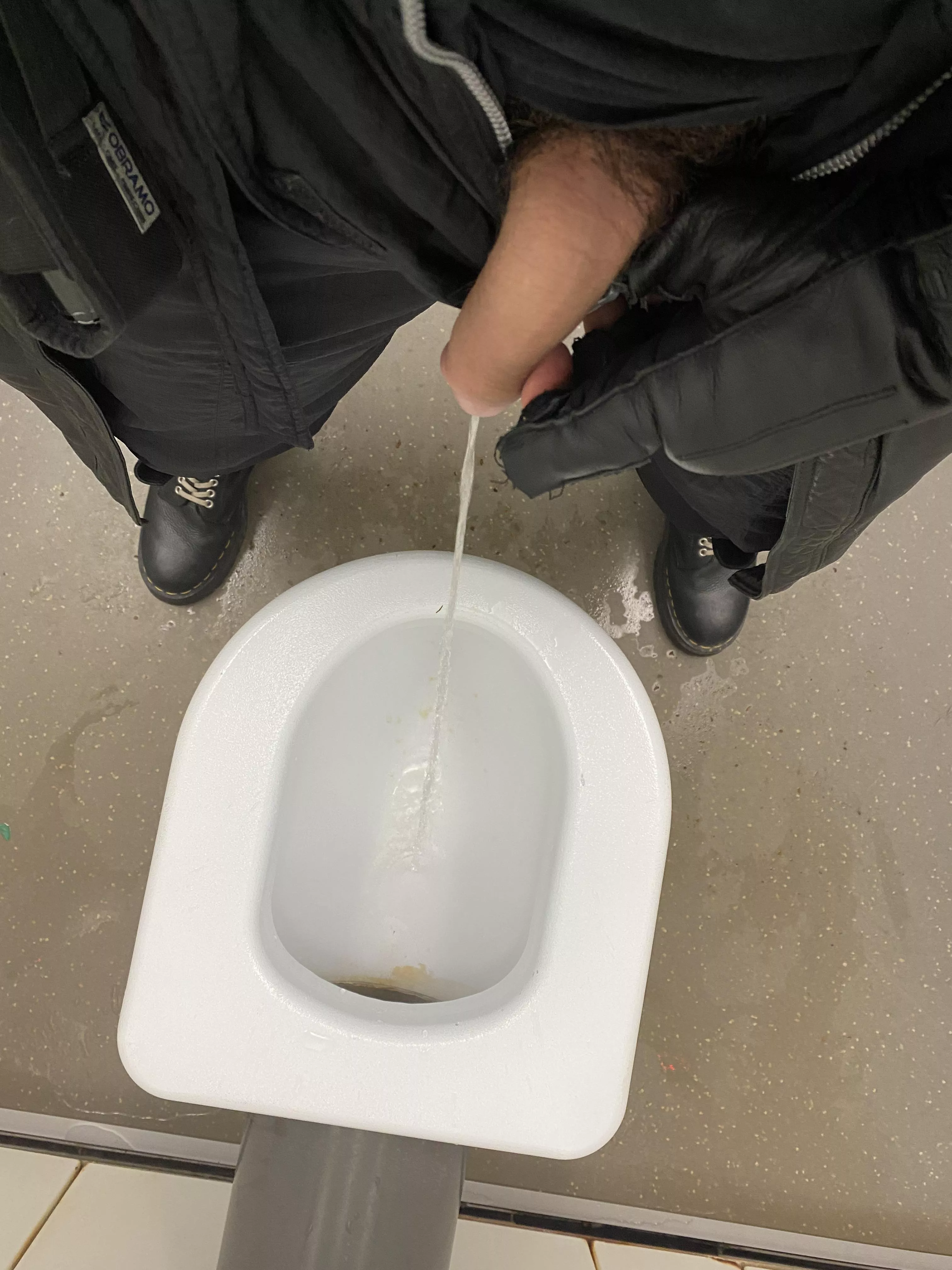 Taking a leak in a filthy public toilet… the whole floor and seat was covered in piss