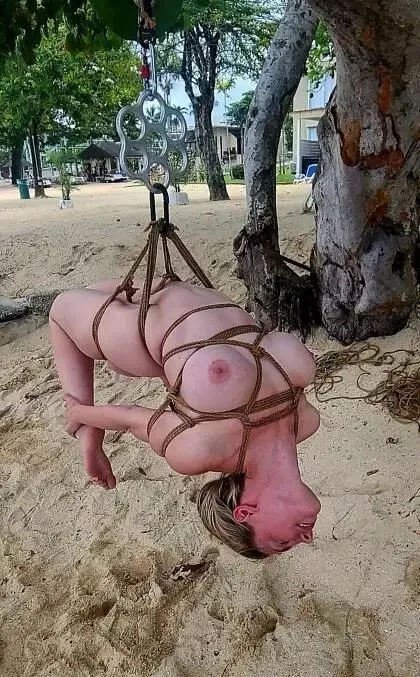 Suspension shibari on the beach