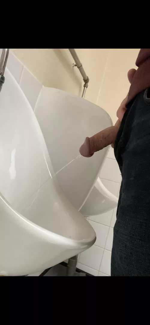 Today at the urinal. I just open my zip and use the fly hole in my trunks (when I wear underwear!), but often see men open their trousers, pull down the top of their underwear, and expose cock and balls. Seems excessive to me, but offers a more generous 