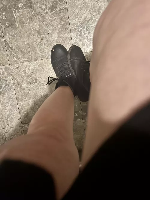 Bare legs and black boots
