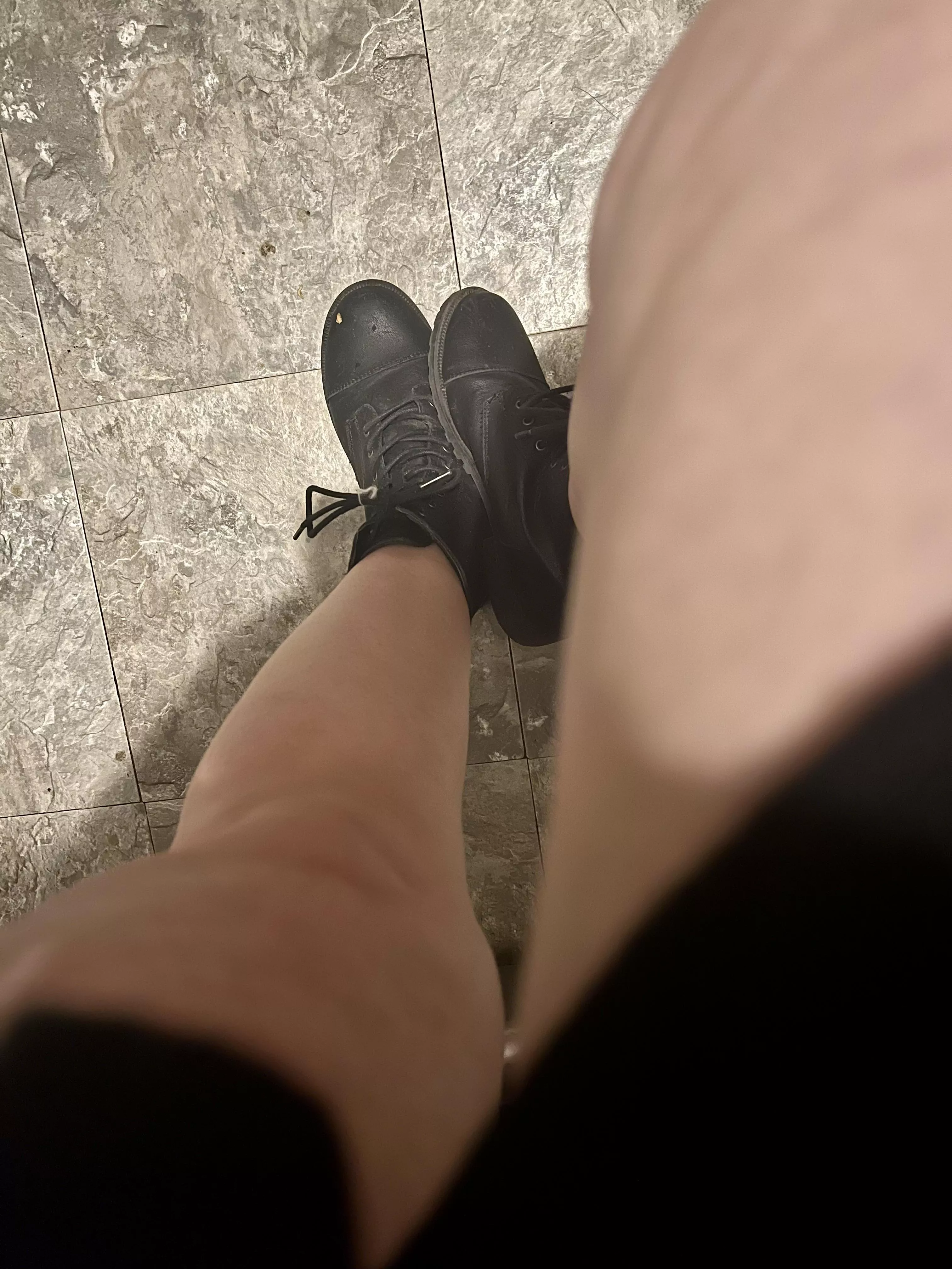 Bare legs and black boots