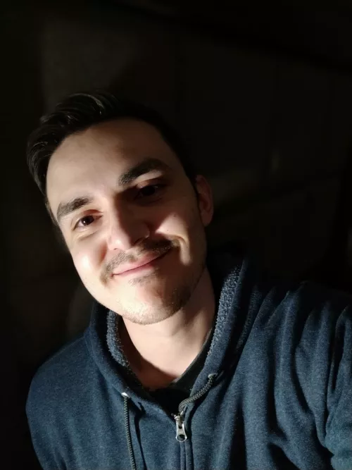 In the dark of this place there's the glow of your face