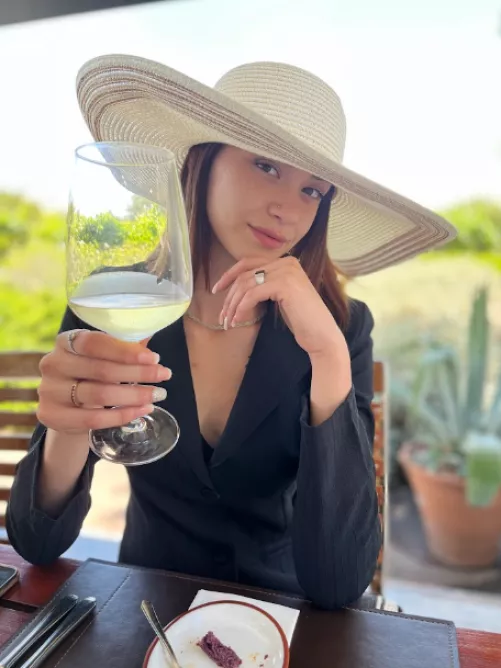 Classy woman drinks wine, cheers!