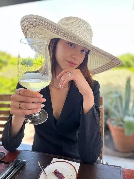 Classy woman drinks wine, cheers!