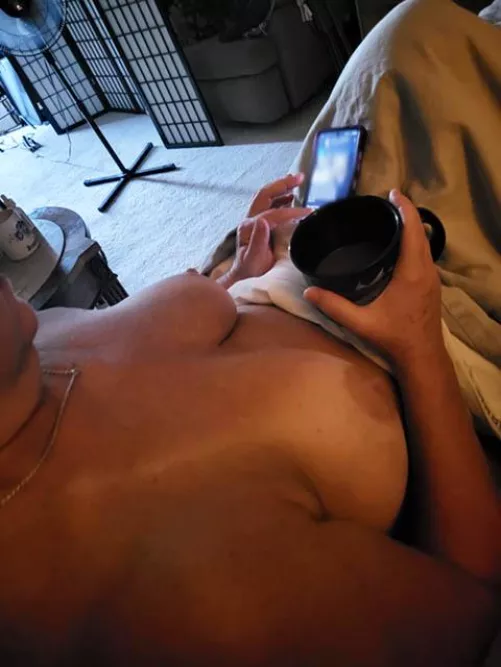 My coffee slowly waking me for work, only thing better is adding a cute young mouth between my MILF legs!