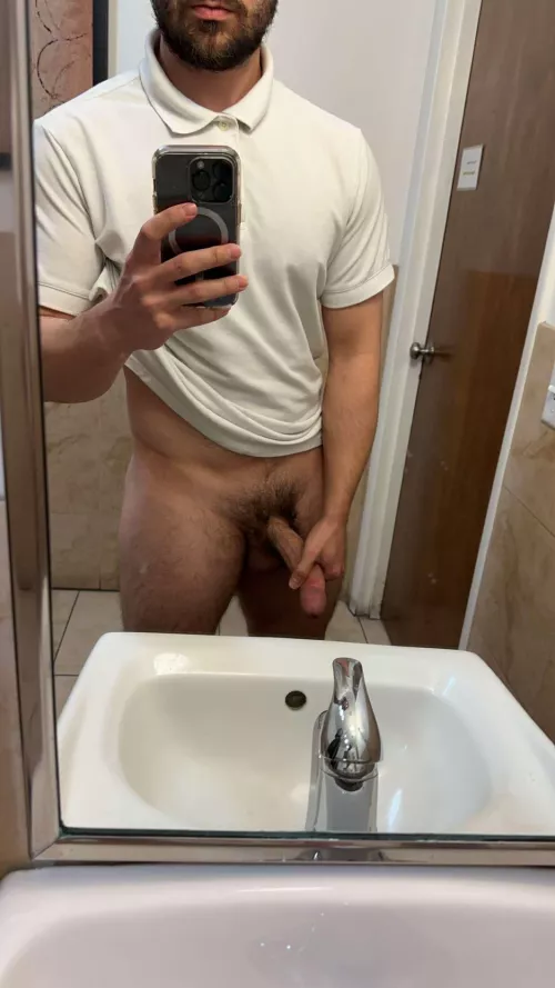 Your hot coworker might be taking cock pictures in the bathroom