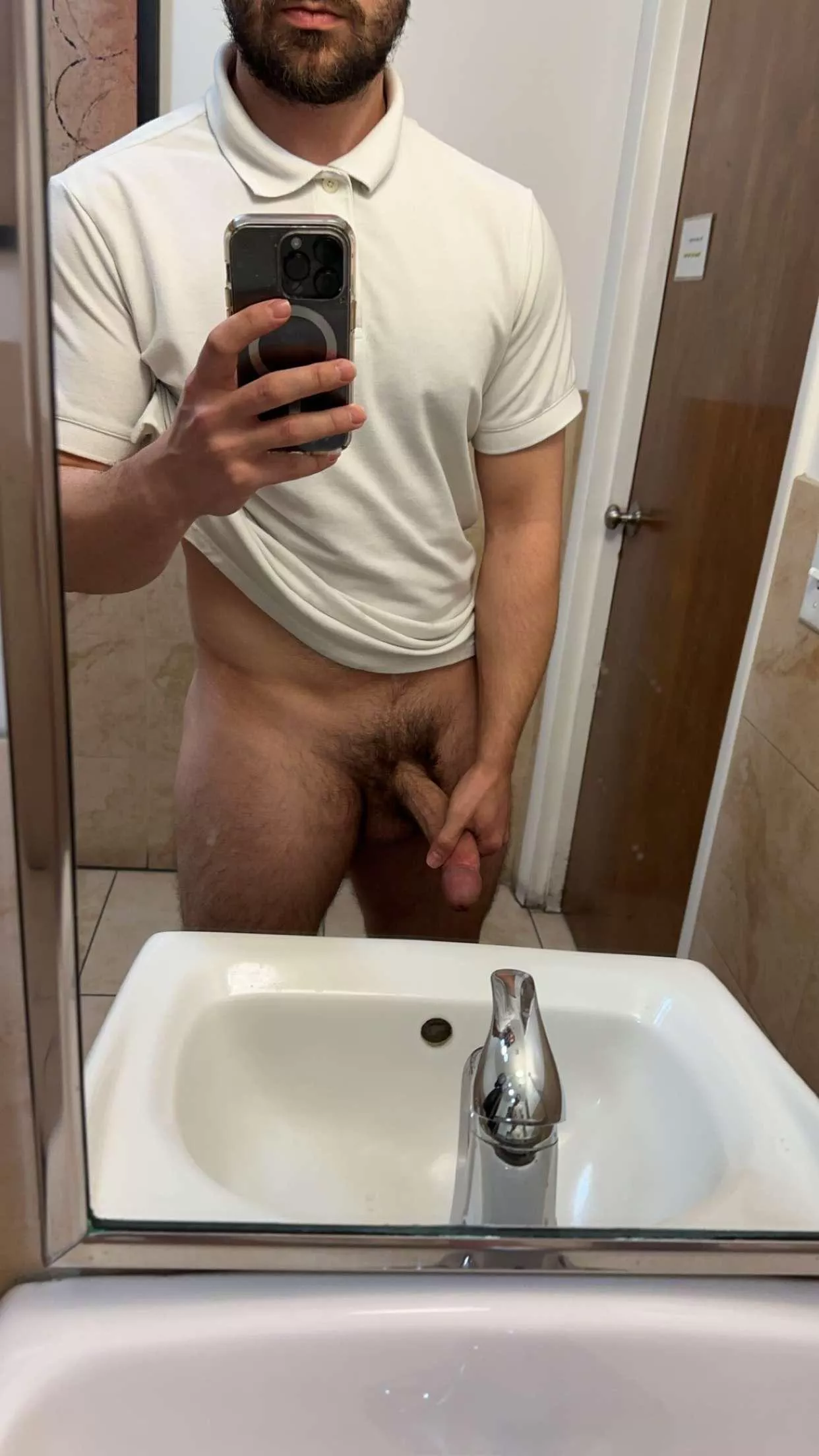 Your hot coworker might be taking cock pictures in the bathroom