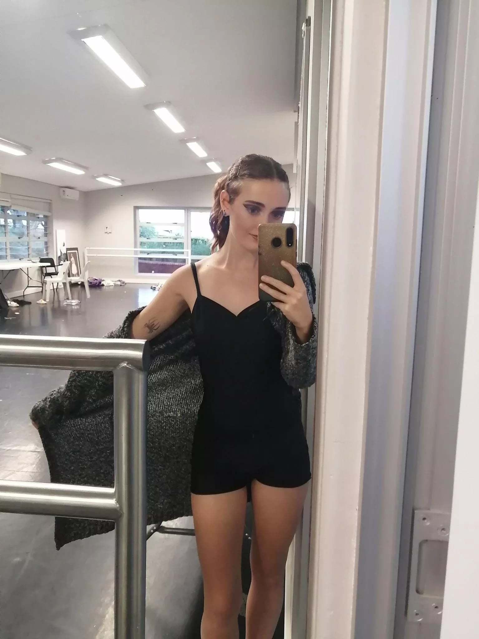 Capturing allure in a mirror, winks and smiles! F18