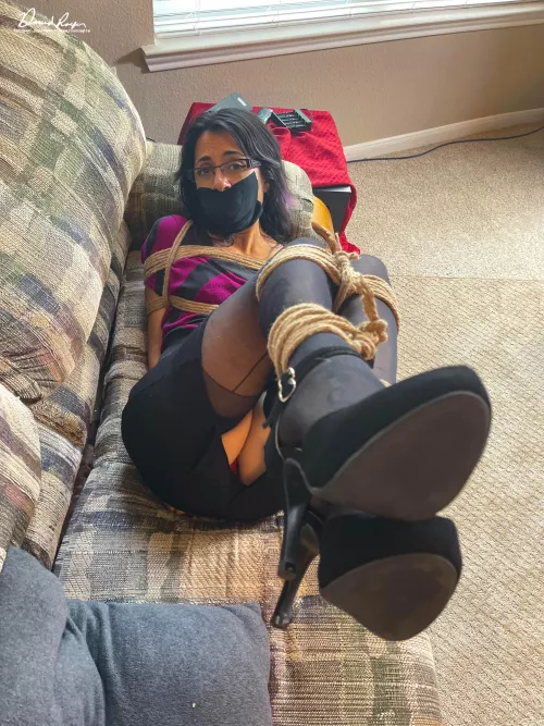 Bri is either showing off her nice heels or asking to be untied.