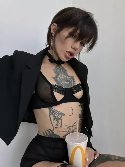 Serious woman loves Happy Meals and Coke