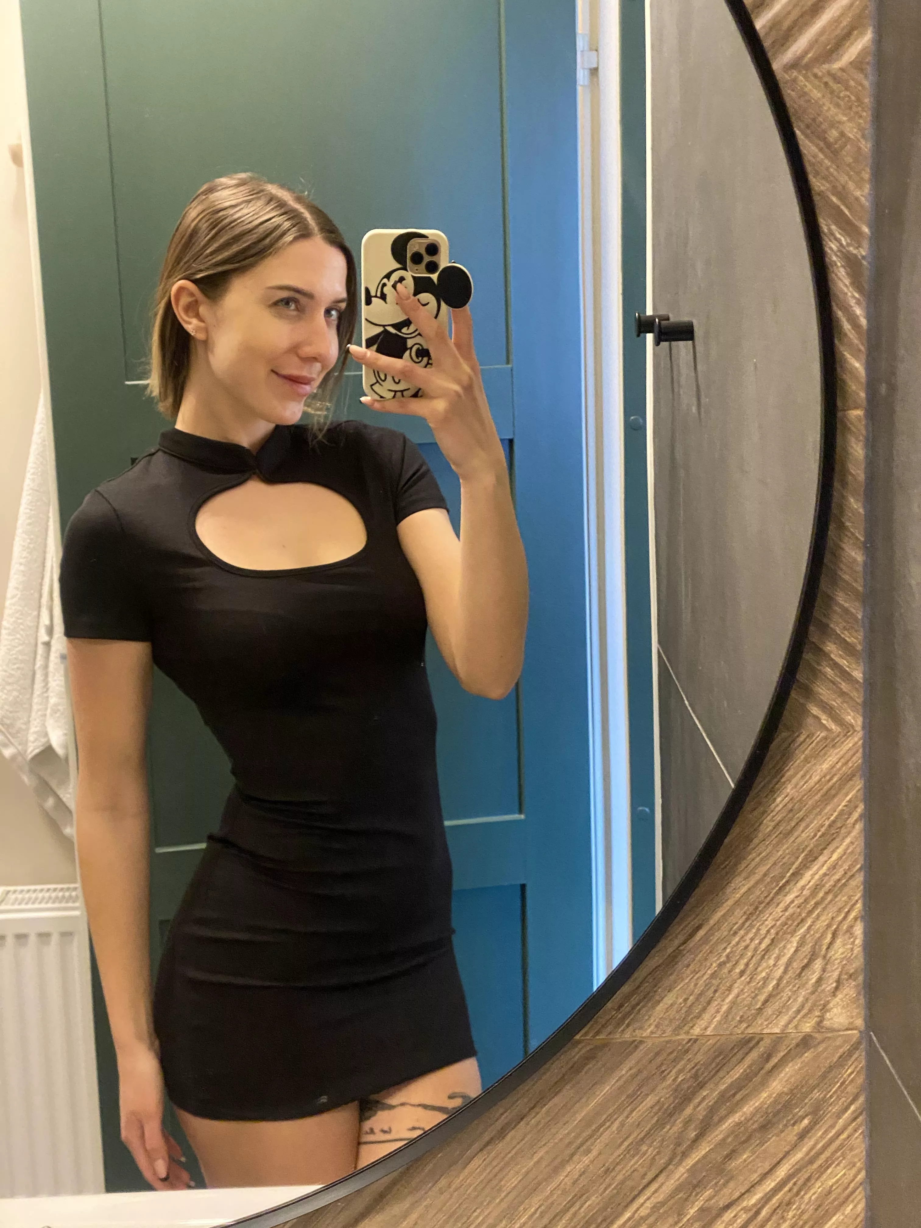 Walking with confidence in my favorite black tight dress