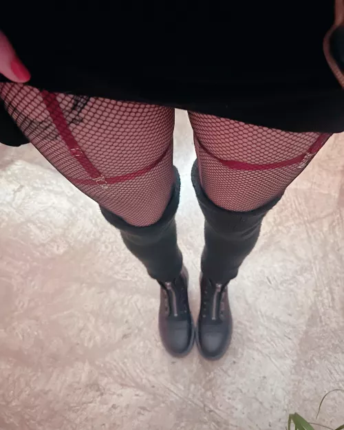 Boots, fishnets, leg warmers and a short skirt for this chilly day