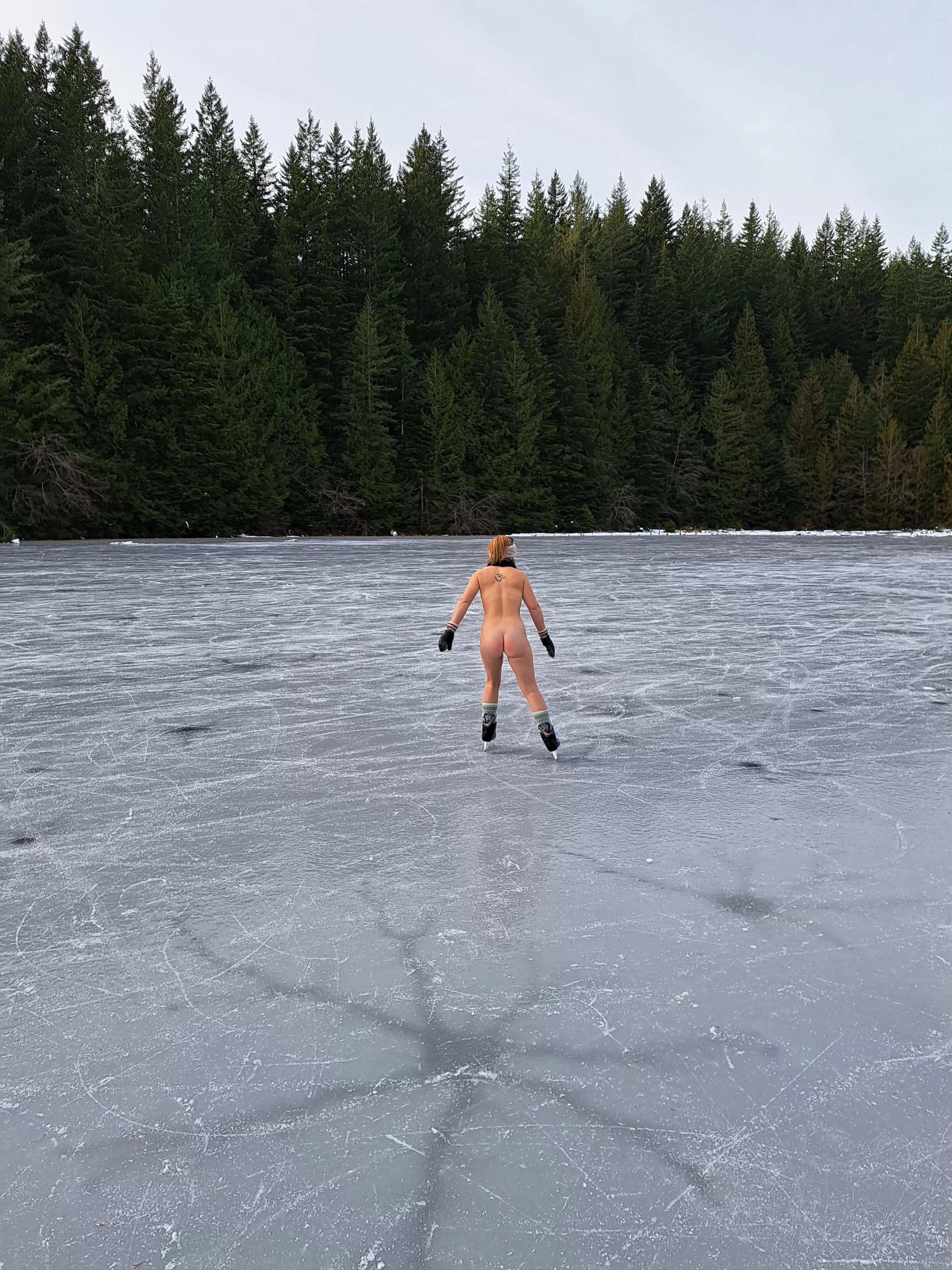 Ice skating on a frozen lake
