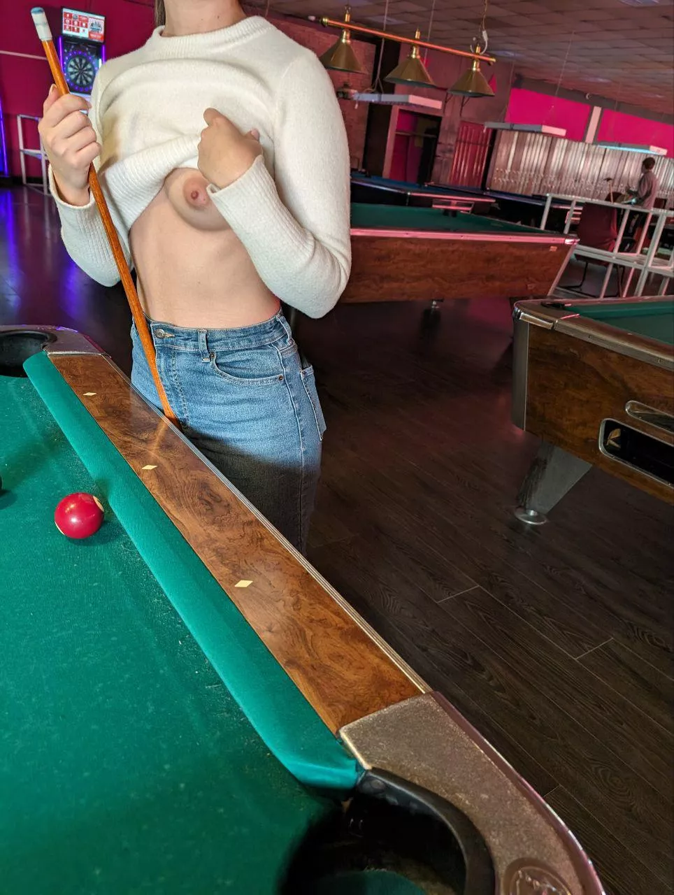 Risky pool! If you pocket a ball, I'll show you a boob!