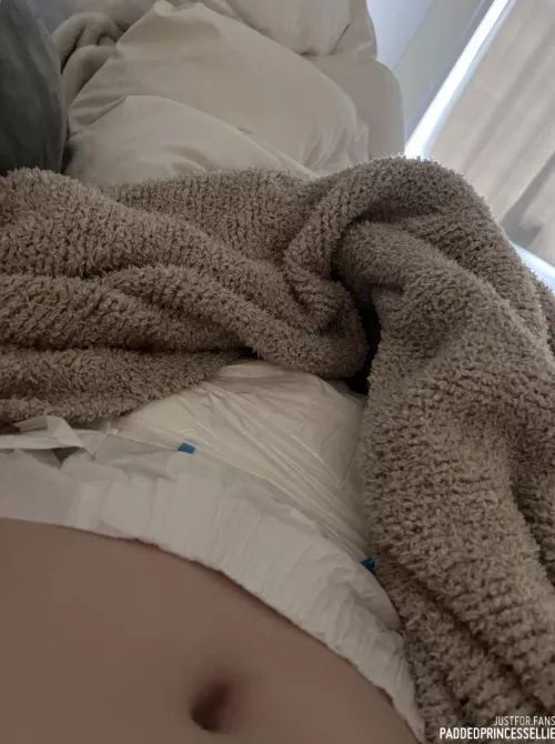 hiding my very full diaper under the blankets 🙈