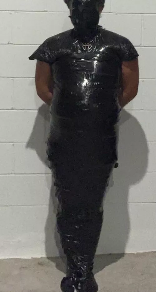 Mummified in black tape