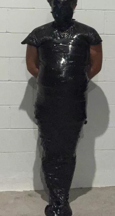 Mummified in black tape