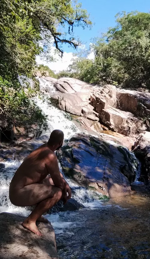Having a good time in a waterfall.