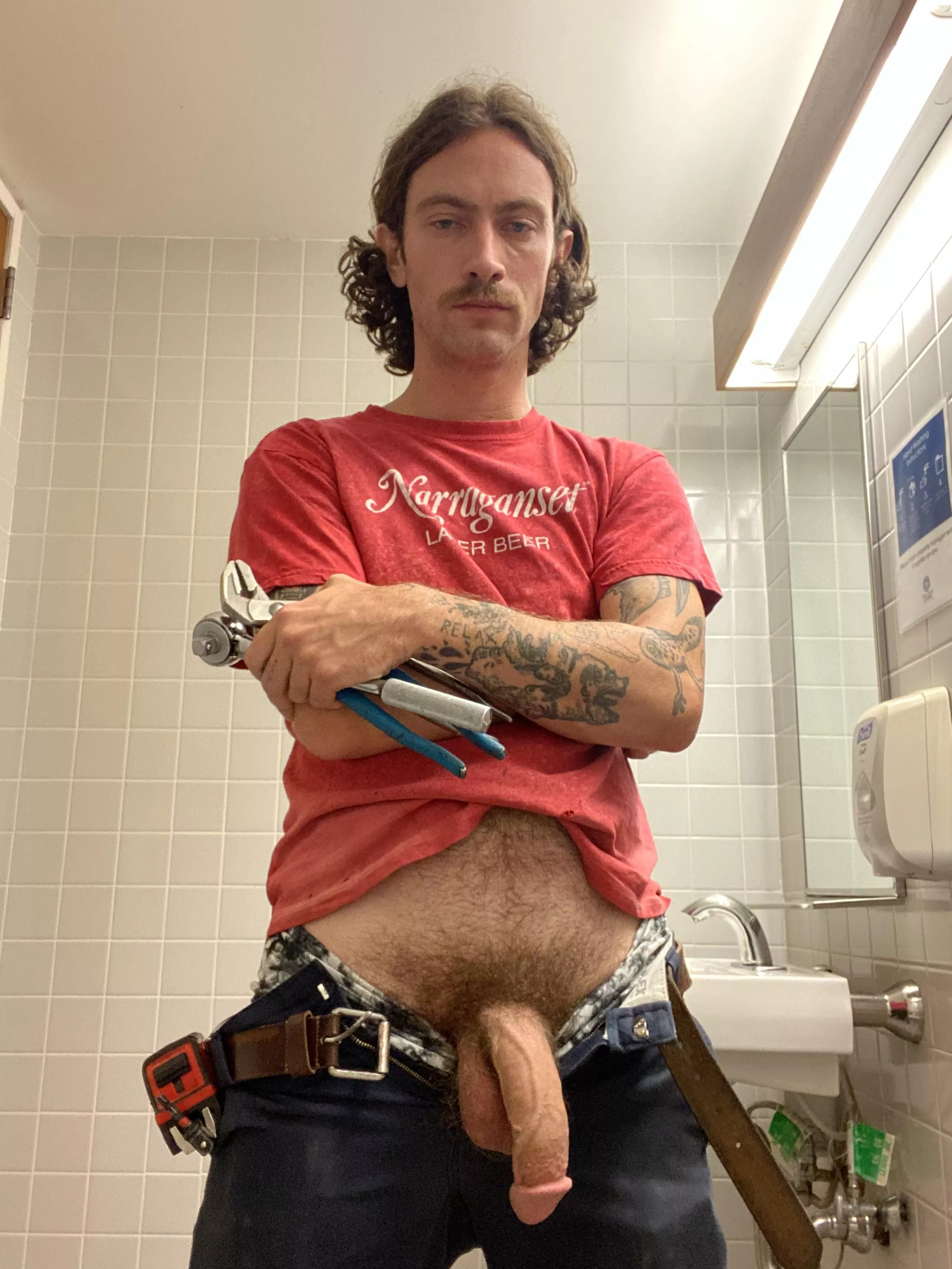 Snuck a quick photo in while swapping some sinks at work. What would you do if you walked in on this big dick plumber?