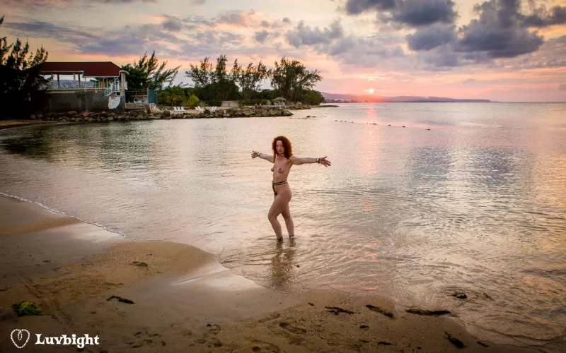 Wide shot of Dee Luvbight on the prude beach at sunset, Hedonism III, Runaway Bay, Jamaica (2008).
