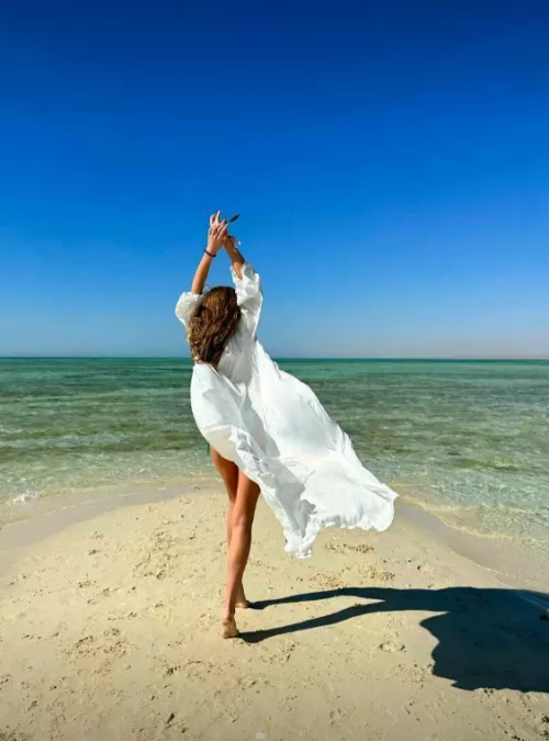 the wind lifts my dress and pleasantly tickles my genitals