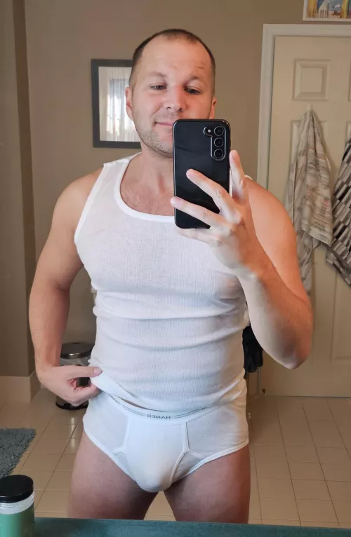 Trying on another man's briefs to see how they fit [27]