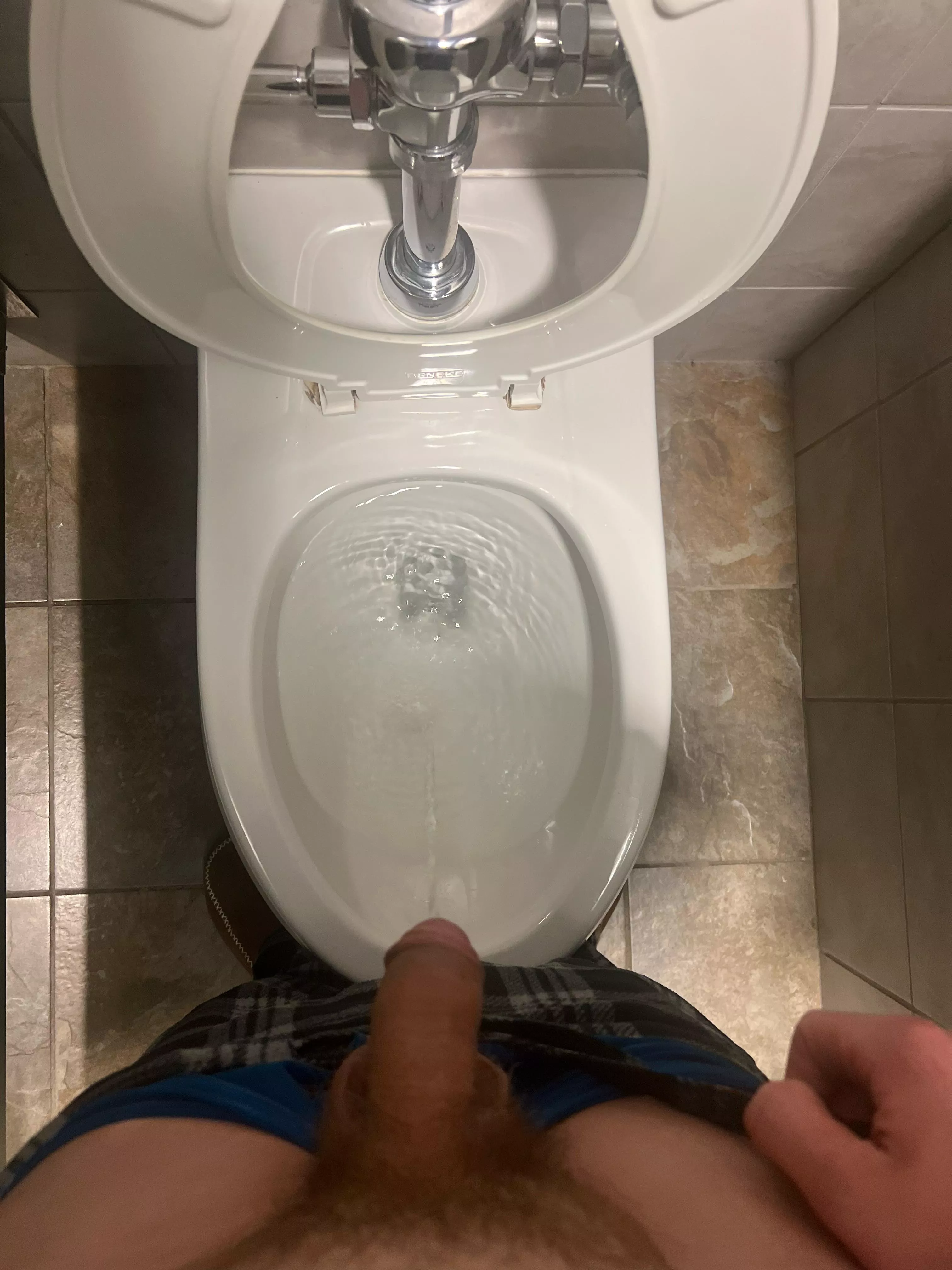 Pissing at the college bathroom 