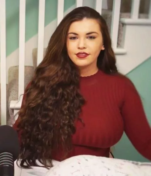 Podcaster in a red sweater