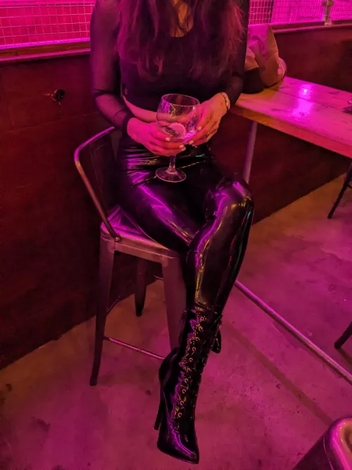 Shiny boots and a crop top to complete the look