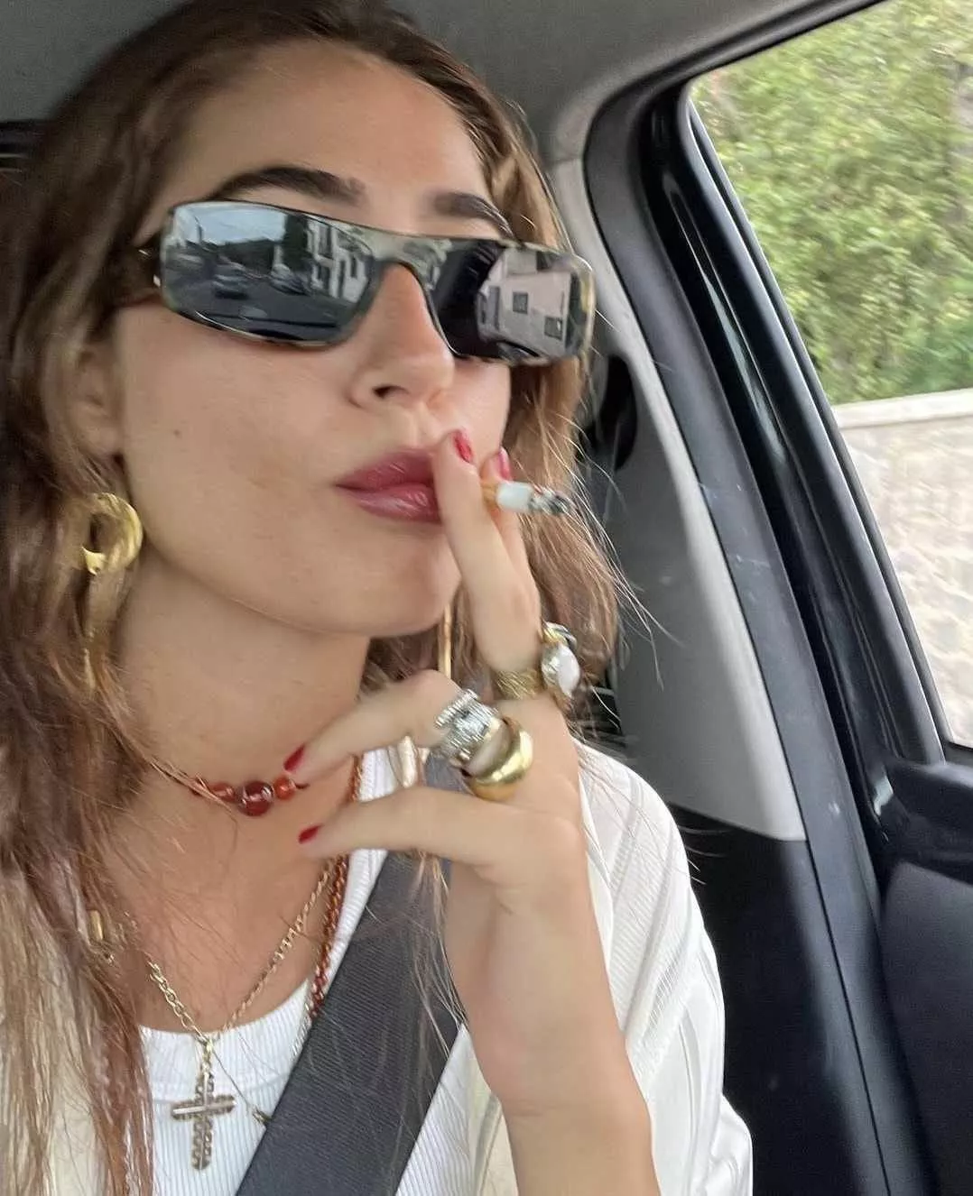 You tell her, “Of COURSE you can smoke in my car. Why would I mind?”