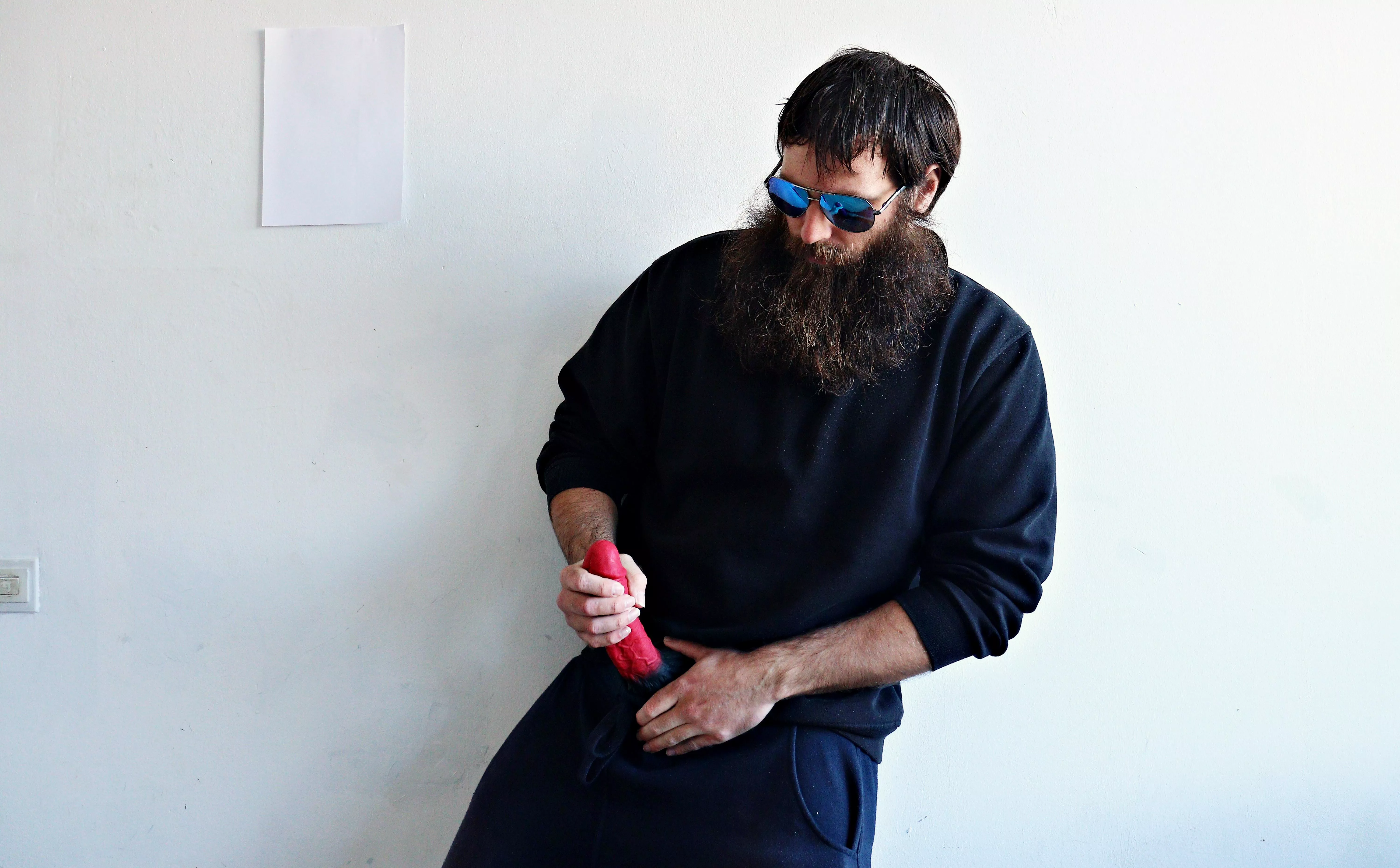 Me, with a large red dildo, while I am wearing sunglasses