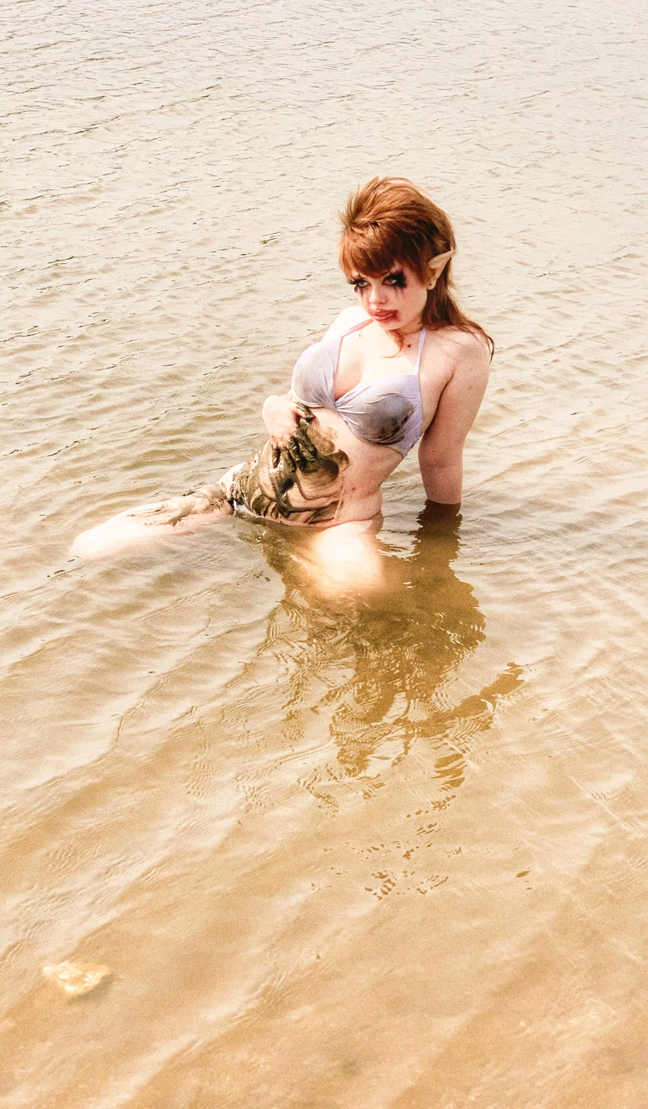 Elf girl playing in the mud