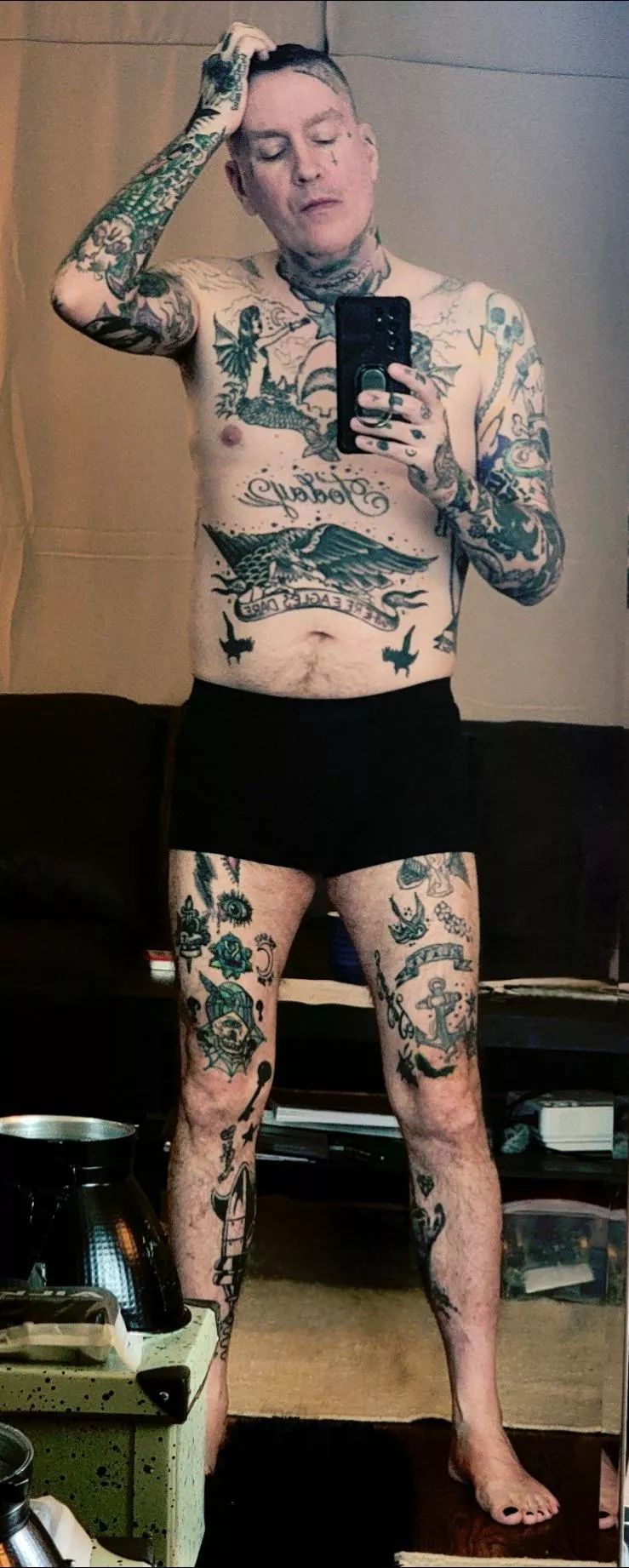 In my studio, preparing for a photoshoot. Who wants to give me head while I get ready?